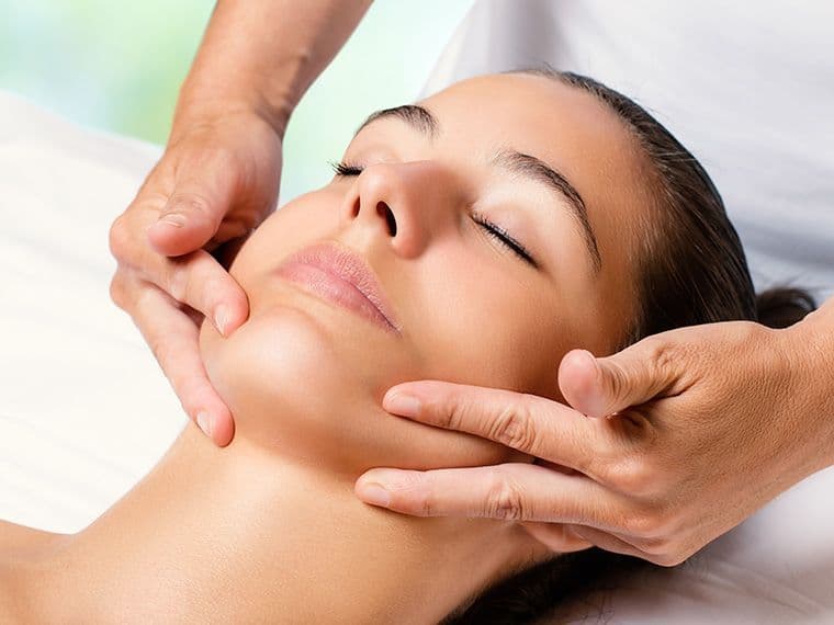 image of a woman having a facial massage