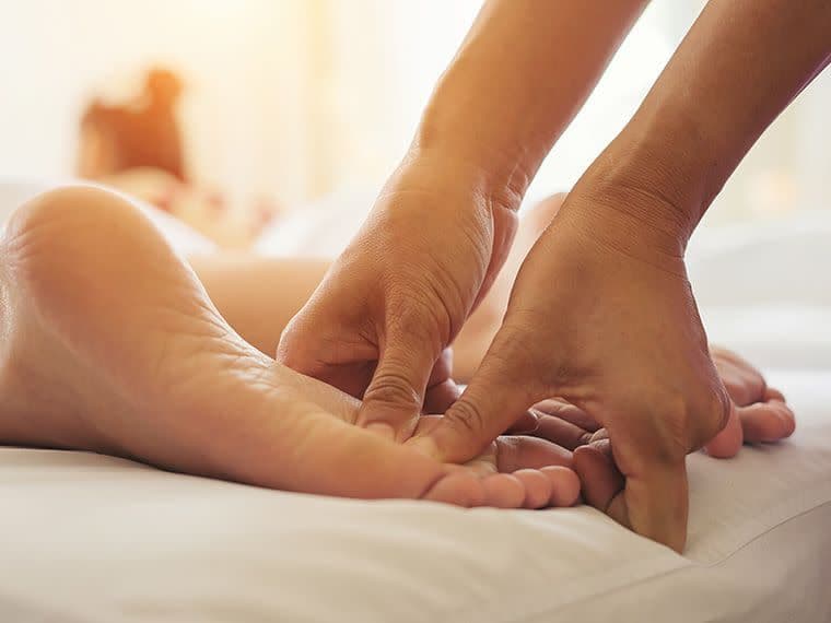 image of someone have reflexology massage on their feet