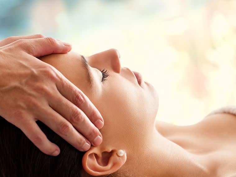 image of a woman having a head massage